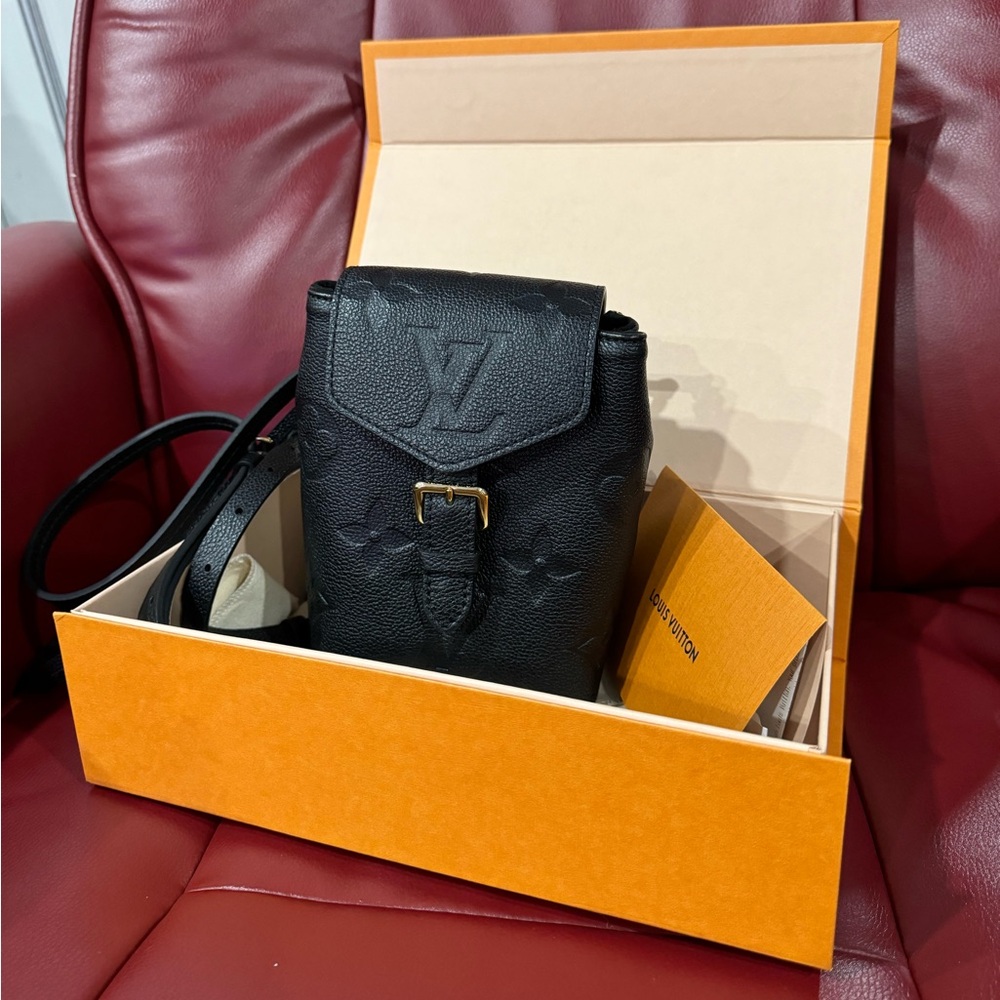 Like new Louis Vuitton black empreiente leather mini backpack